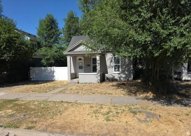 3161 Adams Avenue Ogden, UT 84403 - Photo 2 of 17 Gray exterior with white trim and a covered front porch