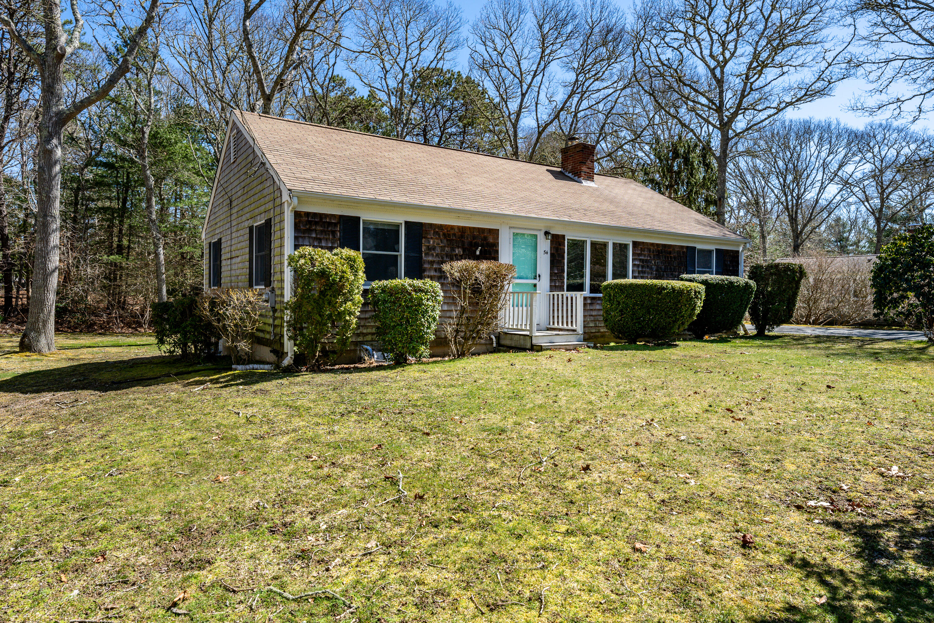 54 Hinckley Circle Osterville, MA 02655 - Photo 29 of 30 a front view of a house with a yard