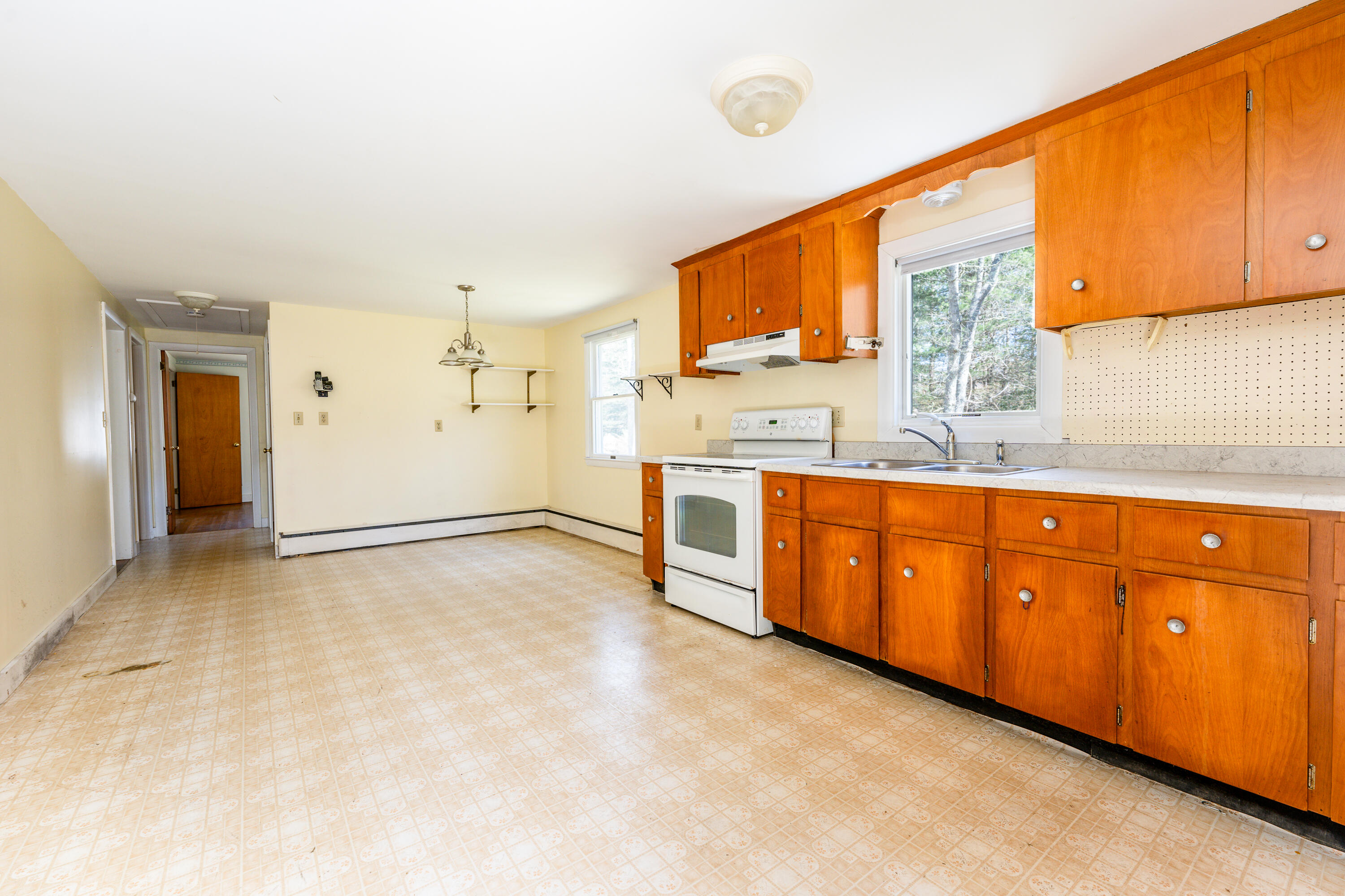 54 Hinckley Circle Osterville, MA 02655 - Photo 3 of 30 a kitchen with stainless steel appliances granite countertop a stove a sink and a refrigerator