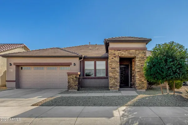 a front view of a house with a garage