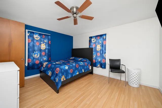 a bedroom with a bed and a table in it