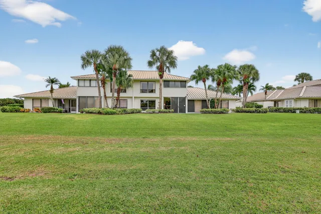 a view of swimming pool is middle in the garden
