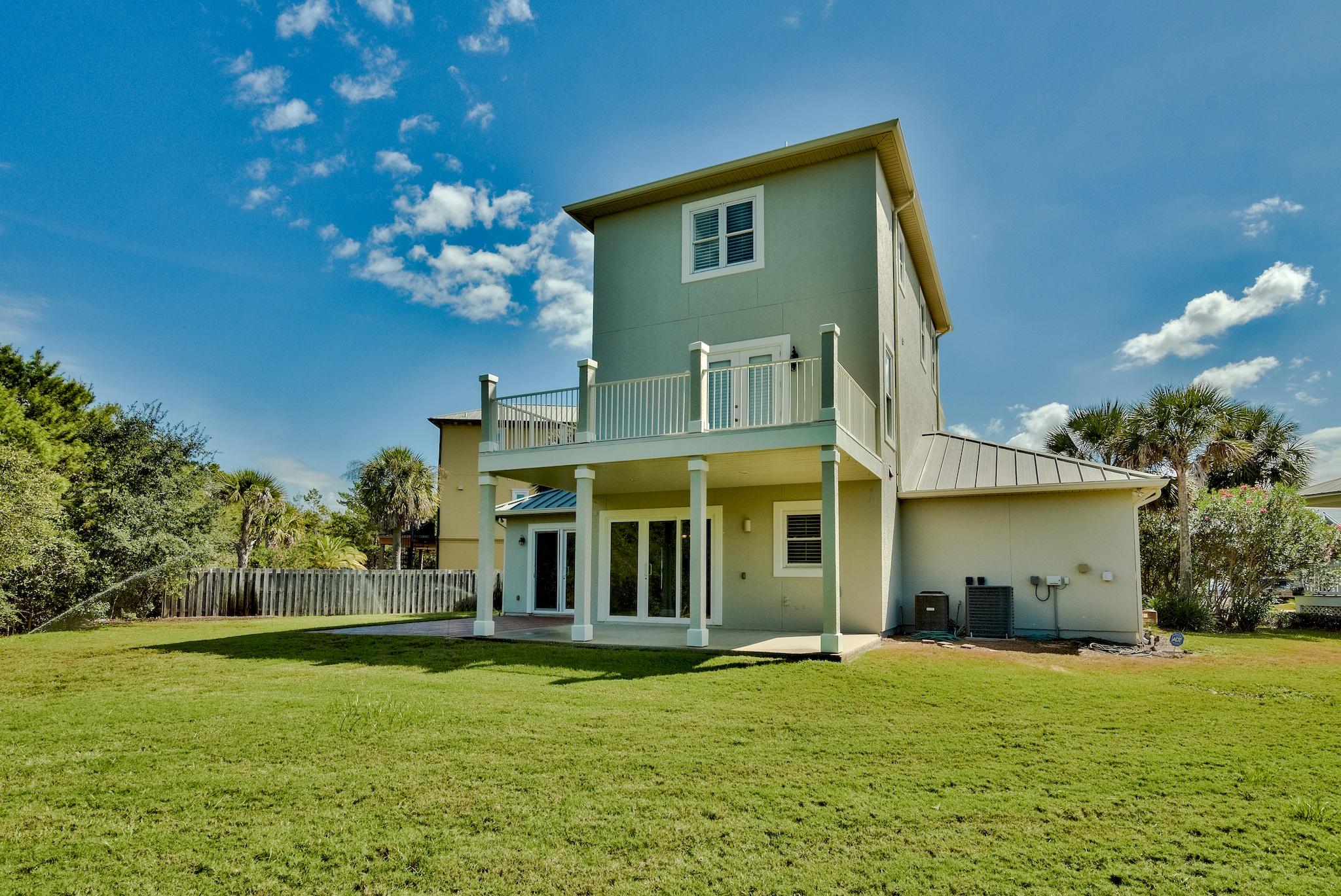 103 Pelican Glide Lane Inlet Beach, FL 32461 - Photo 11 of 47 a view of a house with a backyard