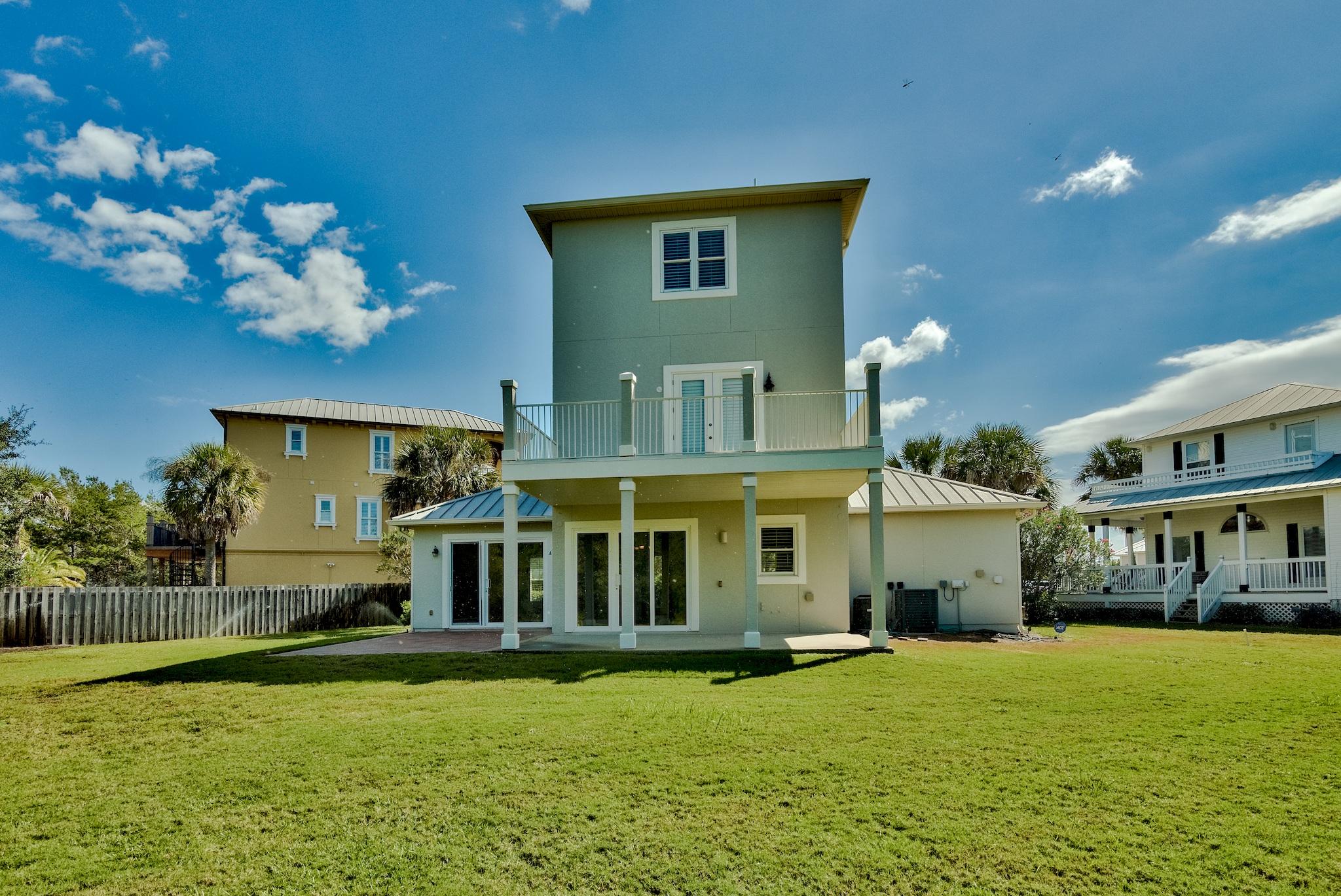 103 Pelican Glide Lane Inlet Beach, FL 32461 - Photo 12 of 47 a view of a house with a swimming pool