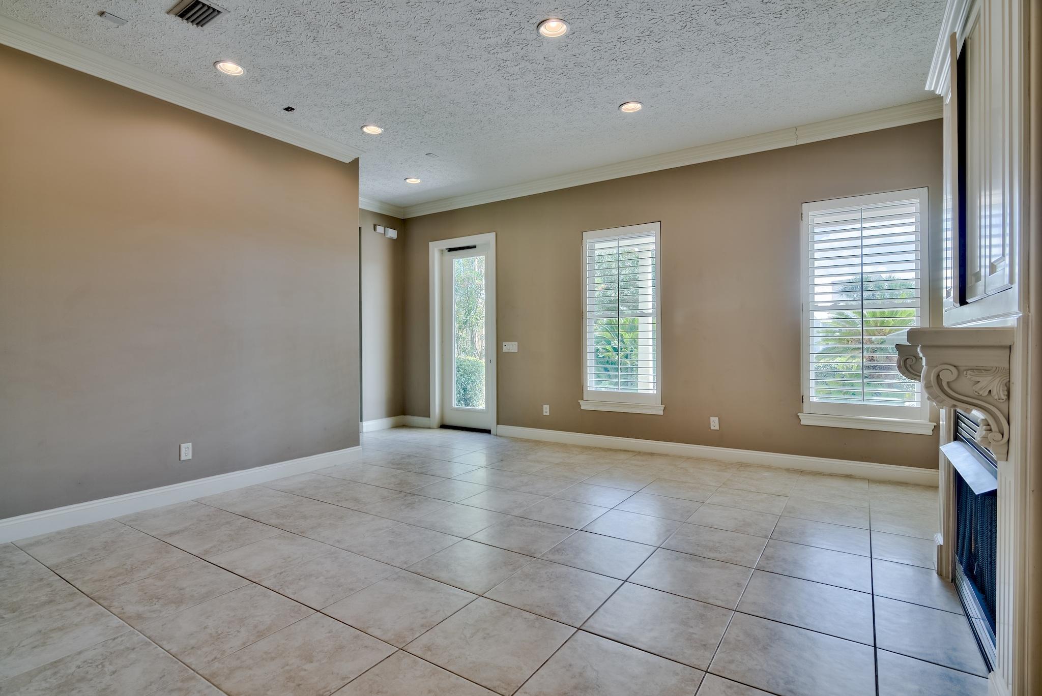 103 Pelican Glide Lane Inlet Beach, FL 32461 - Photo 14 of 47 a view of an empty room with a fireplace and a window