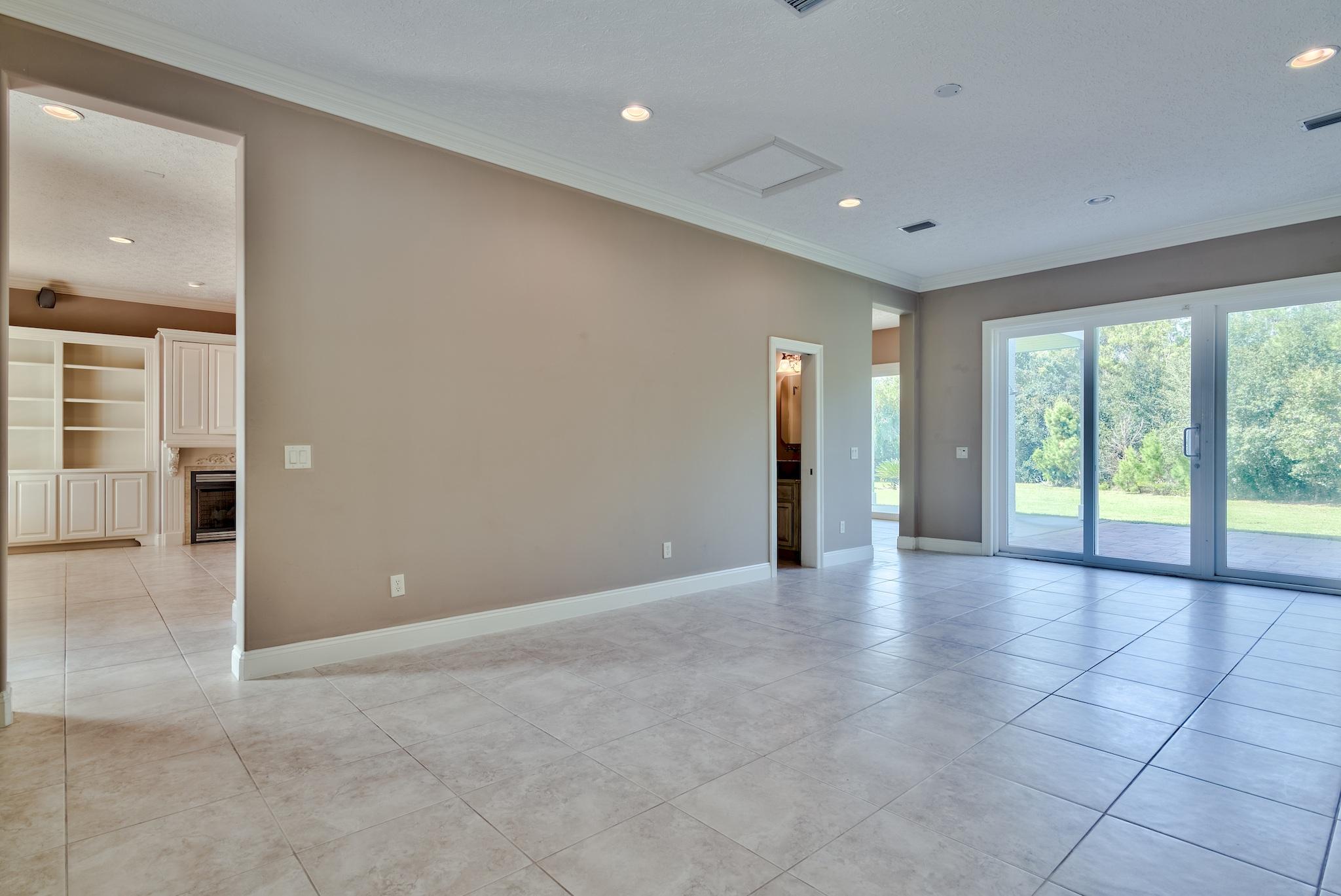 103 Pelican Glide Lane Inlet Beach, FL 32461 - Photo 18 of 47 a view of an empty room with glass door and a window