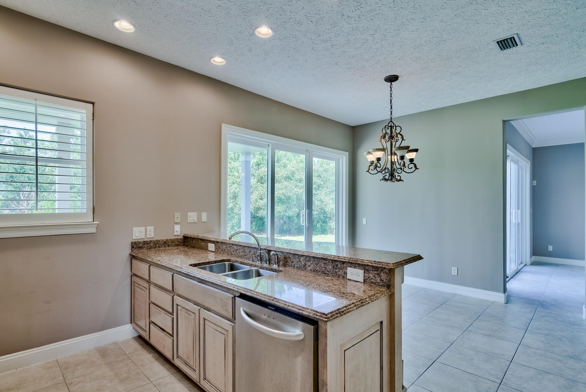 103 Pelican Glide Lane Inlet Beach, FL 32461 - Photo 24 of 47 a kitchen with a sink and a window