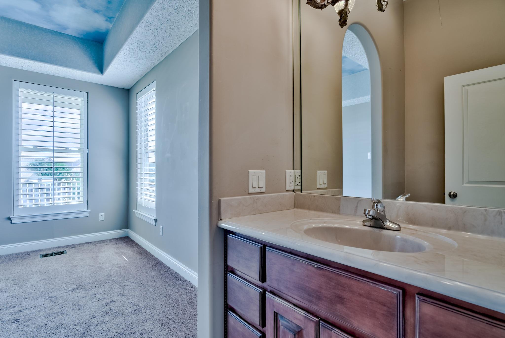 103 Pelican Glide Lane Inlet Beach, FL 32461 - Photo 30 of 47 a bathroom with a sink and a mirror