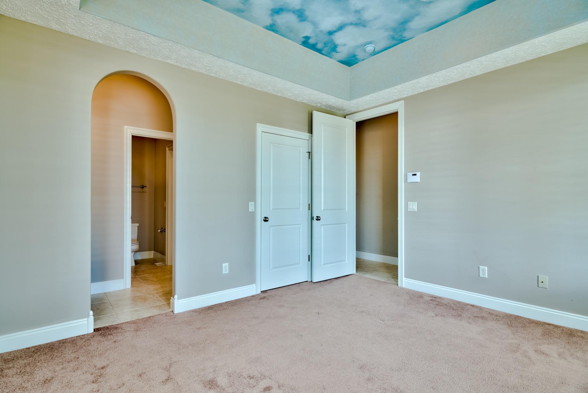 103 Pelican Glide Lane Inlet Beach, FL 32461 - Photo 32 of 47 an empty room with a mirror and a ceiling fan