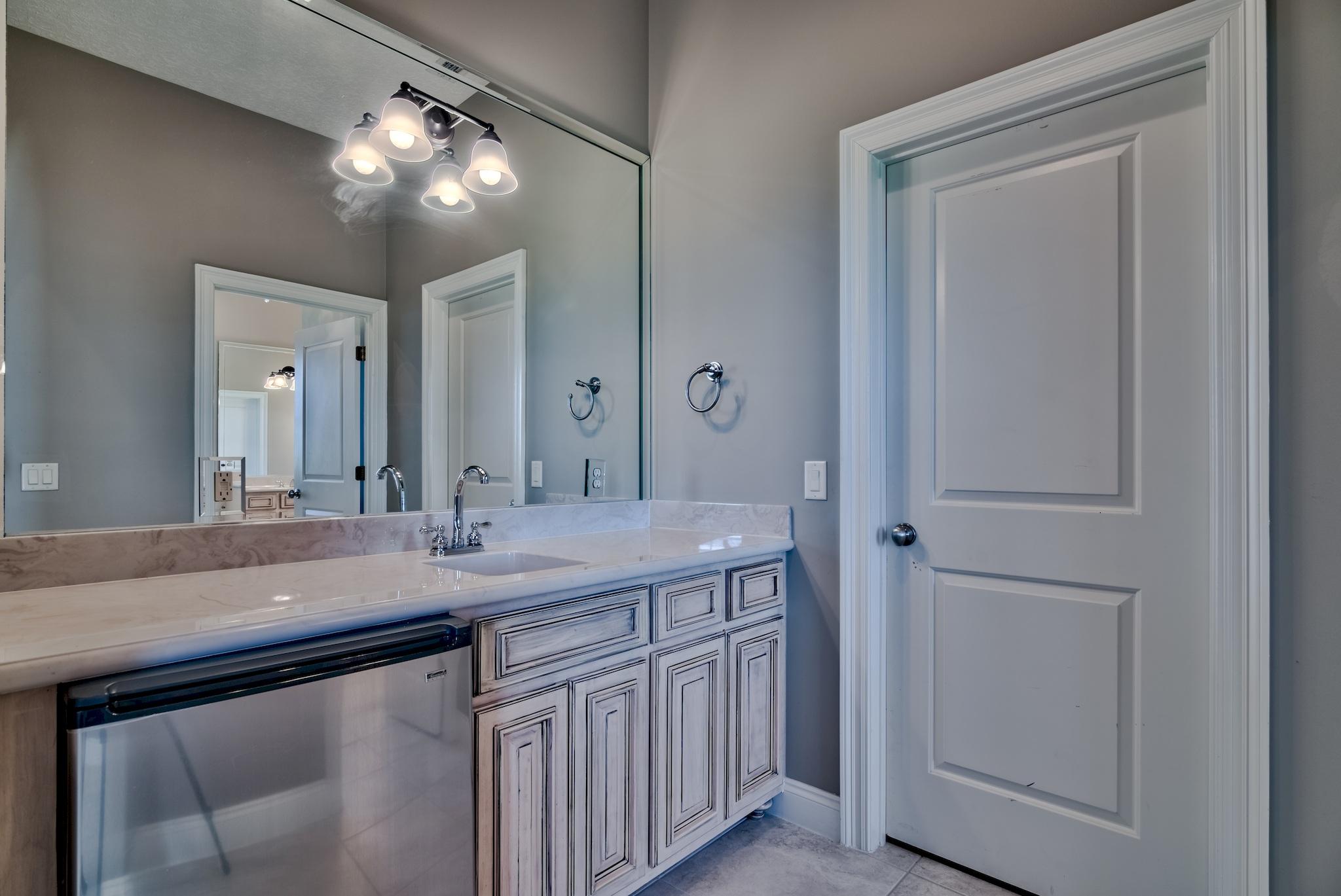 103 Pelican Glide Lane Inlet Beach, FL 32461 - Photo 36 of 47 a bathroom with a sink and a mirror