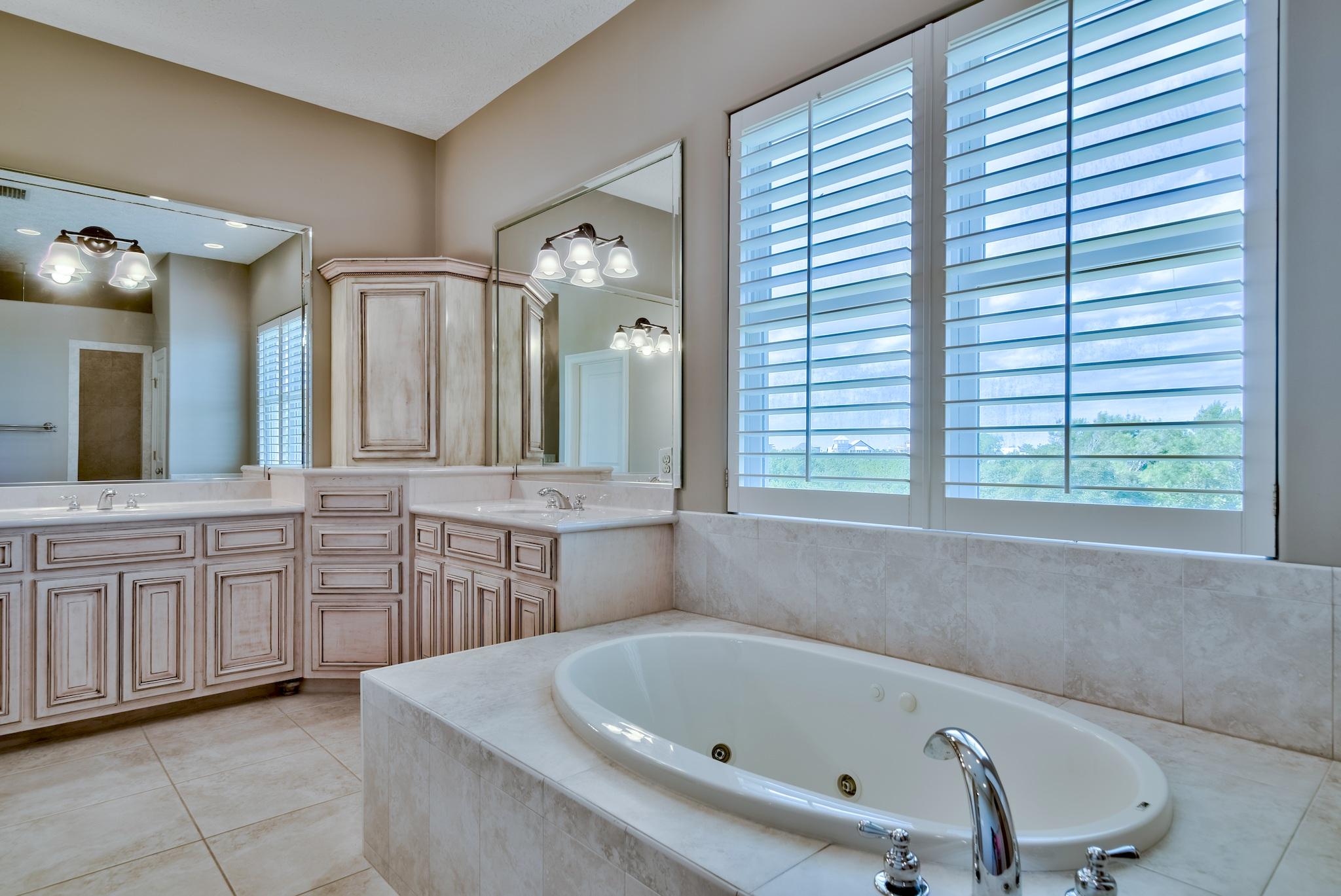 103 Pelican Glide Lane Inlet Beach, FL 32461 - Photo 37 of 47 a bathroom with a bathtub sink and a mirror