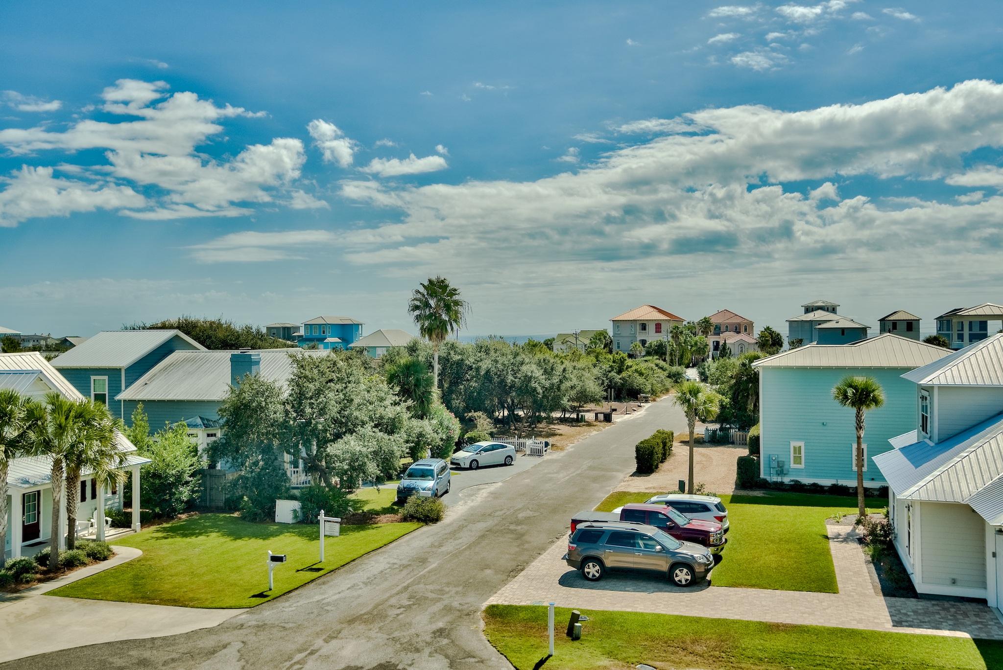 103 Pelican Glide Lane Inlet Beach, FL 32461 - Photo 39 of 47 a view of a swimming pool with a yard