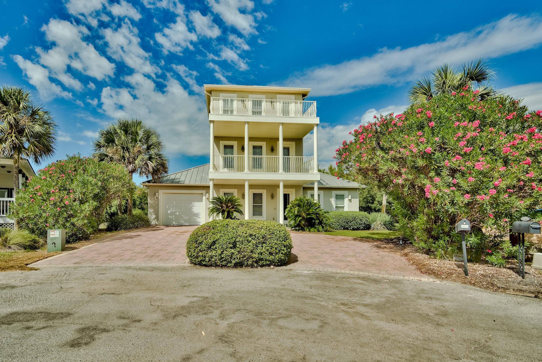 103 Pelican Glide Lane Inlet Beach, FL 32461 - Photo 6 of 47 a front view of a house with a yard