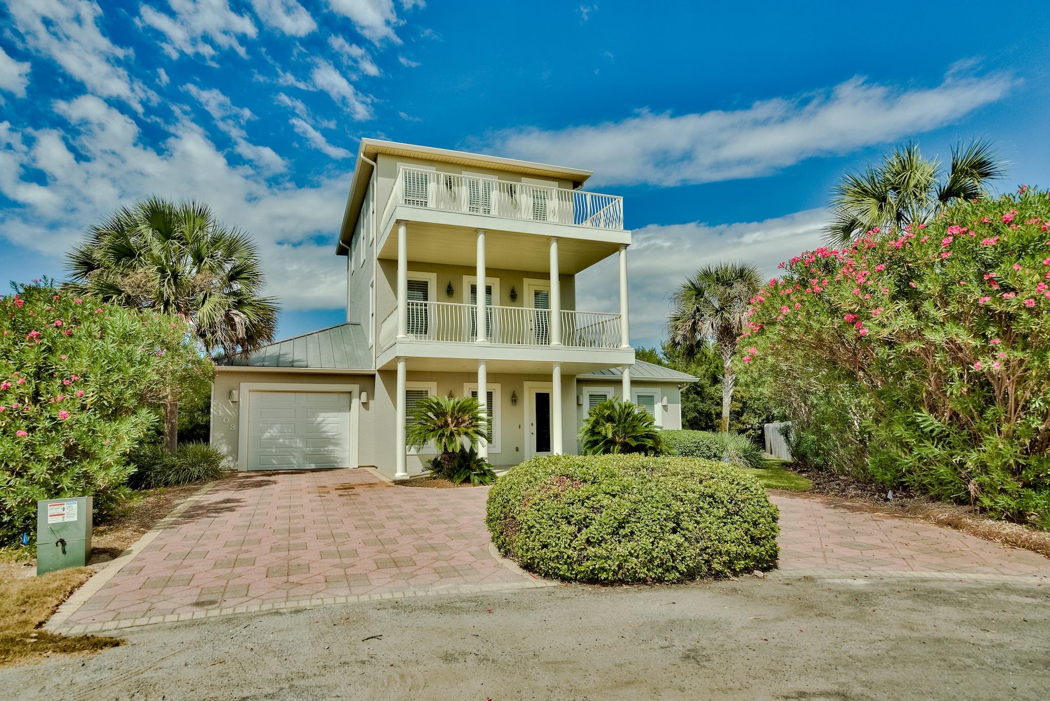 103 Pelican Glide Lane Inlet Beach, FL 32461 - Photo 8 of 47 front view of a house with a garden