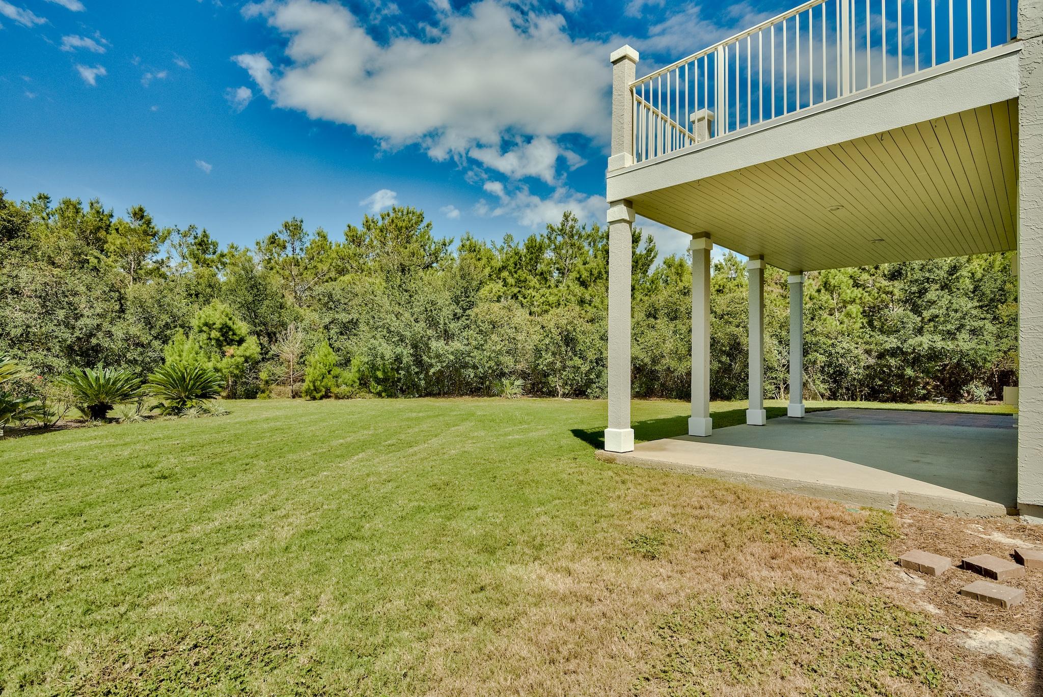 103 Pelican Glide Lane Inlet Beach, FL 32461 - Photo 9 of 47 a view of a garden with an outdoor space