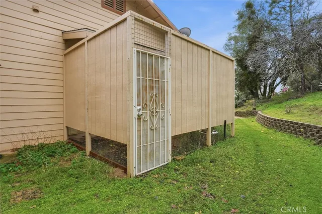 a backyard of a house with a garden and plants
