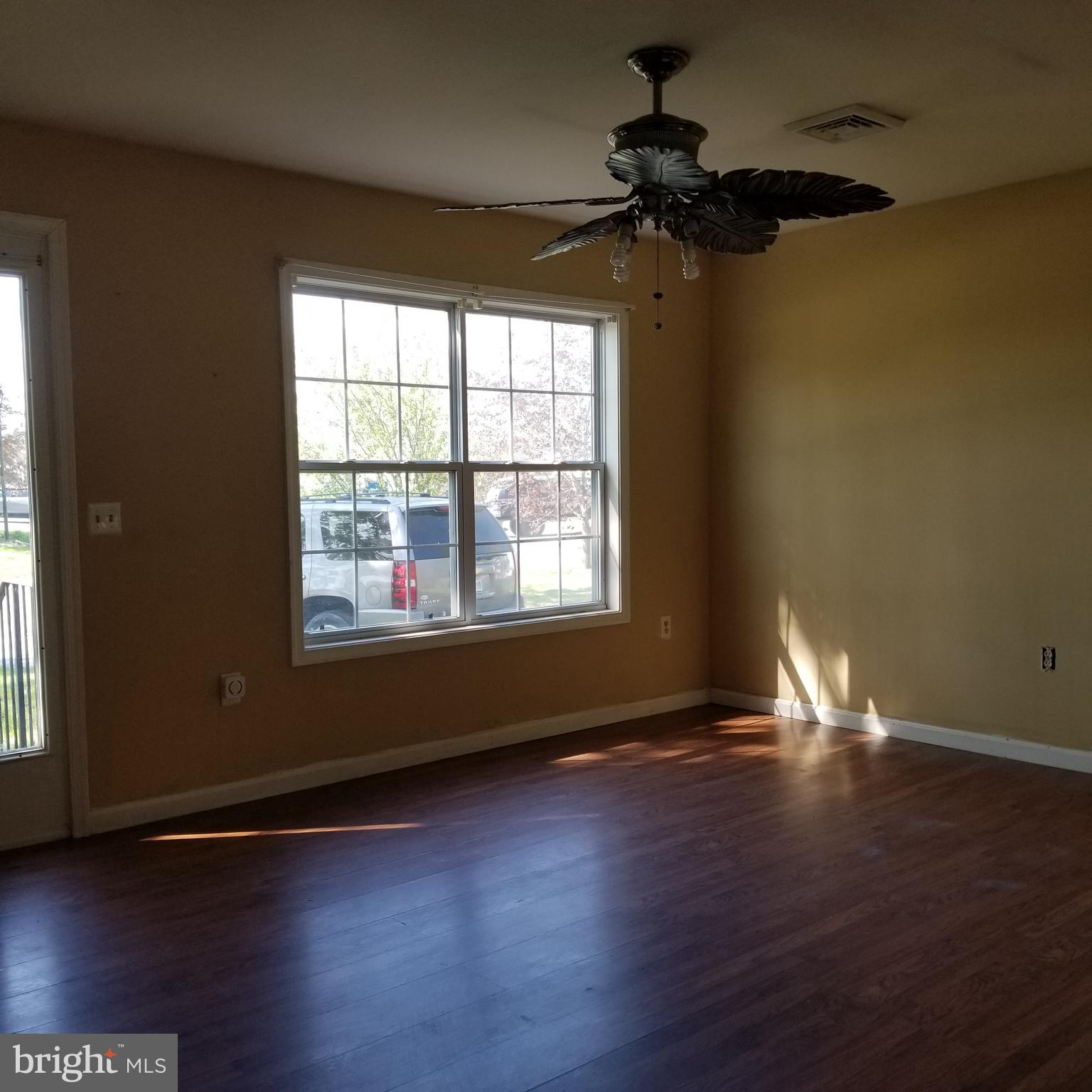 21 Oakview Court Ridgely, MD 21660 - Photo 2 of 17 Living room with double windows