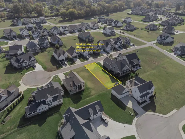 an aerial view of residential house with outdoor space and swimming pool
