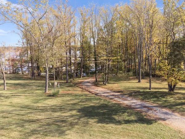 a swimming pool with trees in the background