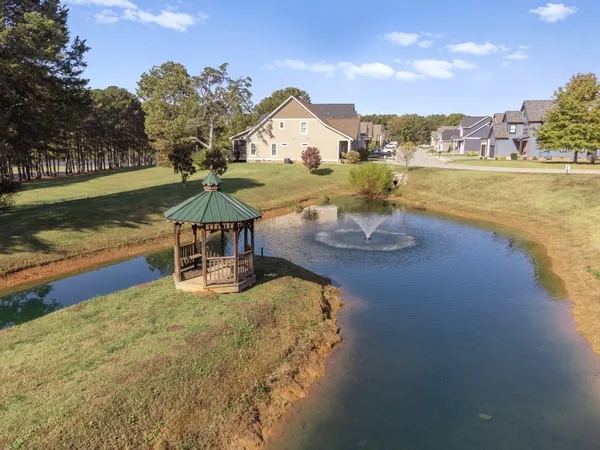 a view of a lake with a house in the background