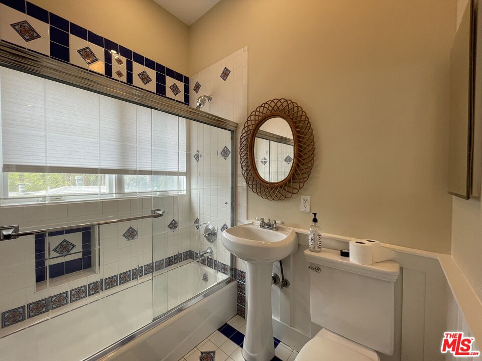 722 Palms Boulevard Venice, CA 90291 - Photo 12 of 19 a bathroom with a sink a toilet and a mirror