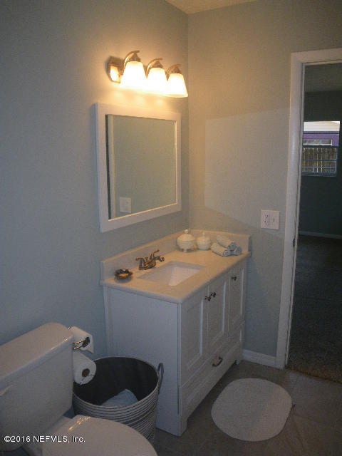 402 Jasmine Road St. Augustine, FL 32086 - Photo 13 of 33 a bathroom with a sink toilet and mirror