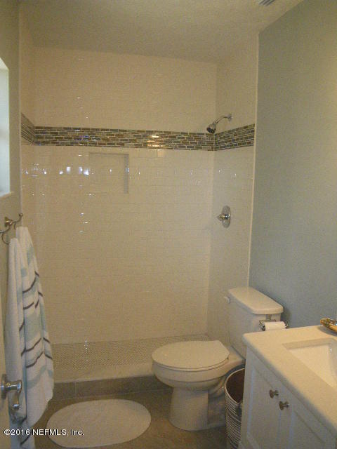 402 Jasmine Road St. Augustine, FL 32086 - Photo 14 of 33 a bathroom with a toilet a sink and shower