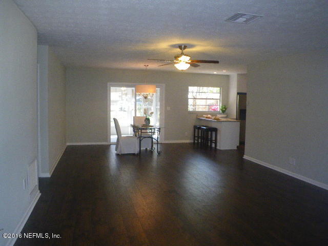 402 Jasmine Road St. Augustine, FL 32086 - Photo 17 of 33 a view of a livingroom with furniture wooden floor and a window