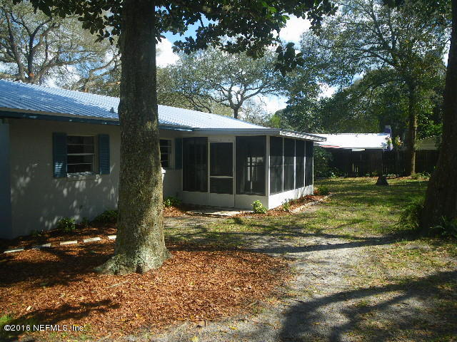 402 Jasmine Road St. Augustine, FL 32086 - Photo 22 of 33 a view of a house with backyard and tree