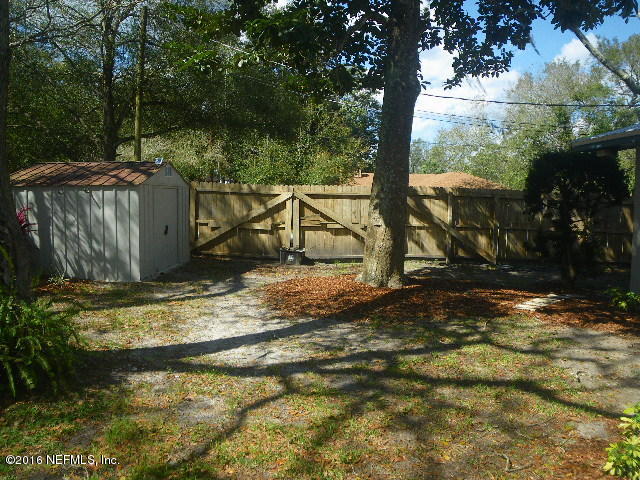 402 Jasmine Road St. Augustine, FL 32086 - Photo 23 of 33 a view of a wooden deck next to a yard