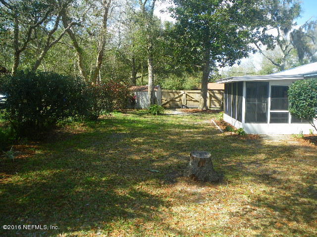 402 Jasmine Road St. Augustine, FL 32086 - Photo 24 of 33 a view of a house with a yard and sitting area