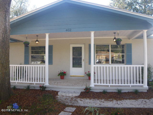 402 Jasmine Road St. Augustine, FL 32086 - Photo 27 of 33 a porch with a table in front of it