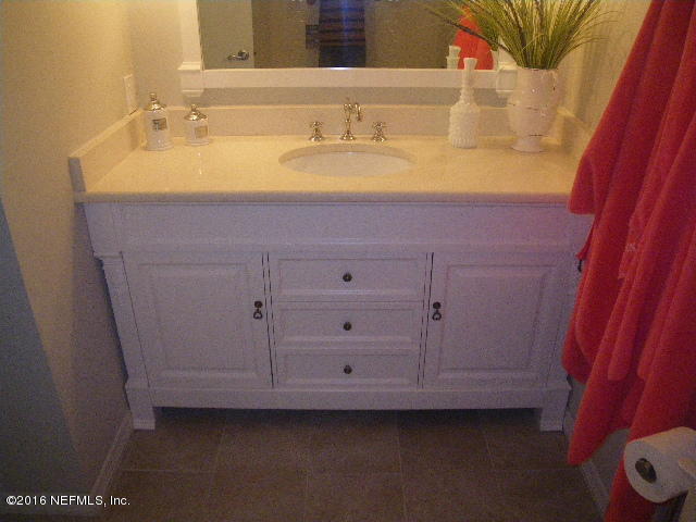 402 Jasmine Road St. Augustine, FL 32086 - Photo 31 of 33 a bathroom with a sink and a mirror