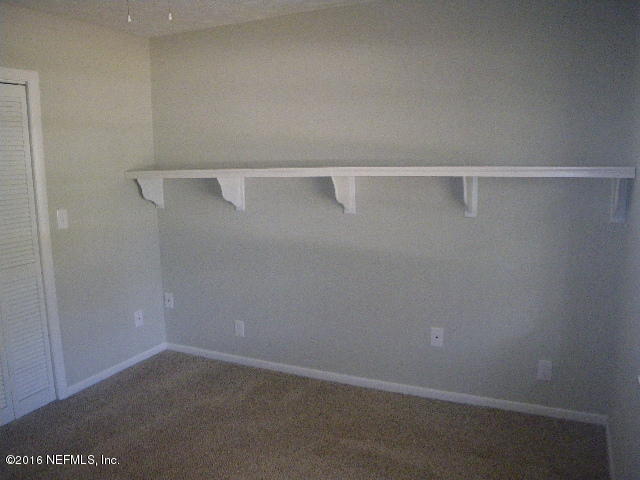 402 Jasmine Road St. Augustine, FL 32086 - Photo 9 of 33 a view of small space with racks on the wall