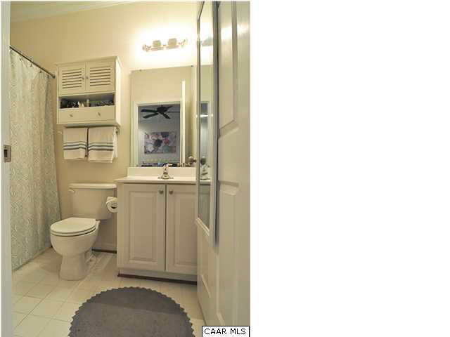 823 Rainier Road Charlottesville, VA 22903 - Photo 39 of 39 a bathroom with a granite countertop toilet sink and mirror