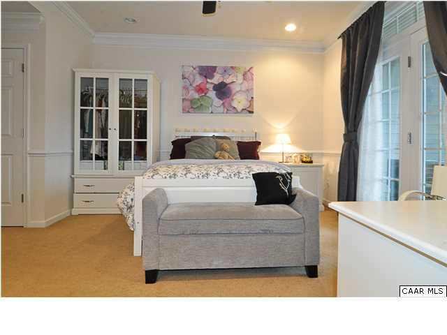 823 Rainier Road Charlottesville, VA 22903 - Photo 4 of 39 a living room with a bed furniture and a large window