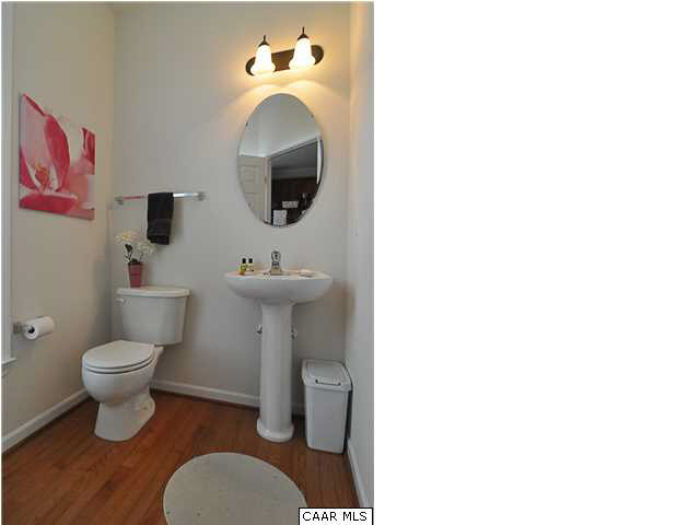 823 Rainier Road Charlottesville, VA 22903 - Photo 8 of 39 a bathroom with a toilet sink and mirror