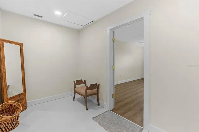 a bathroom with a sink mirror and a bathtub