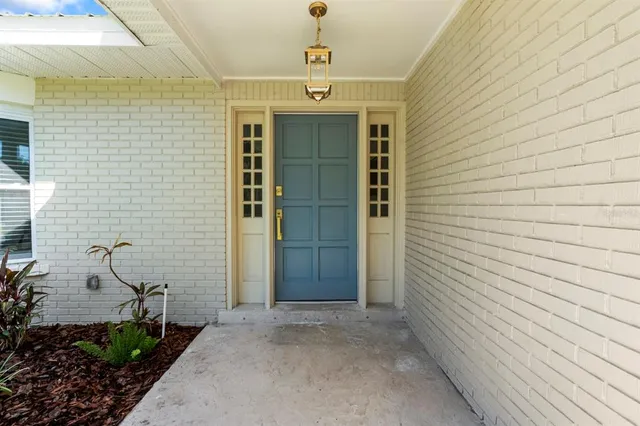 a view of a house with backyard and garage