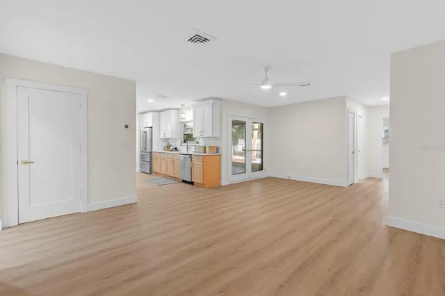 a bathroom with a sink a mirror and a shower