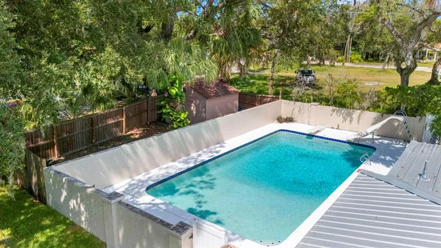 an aerial view of house with yard