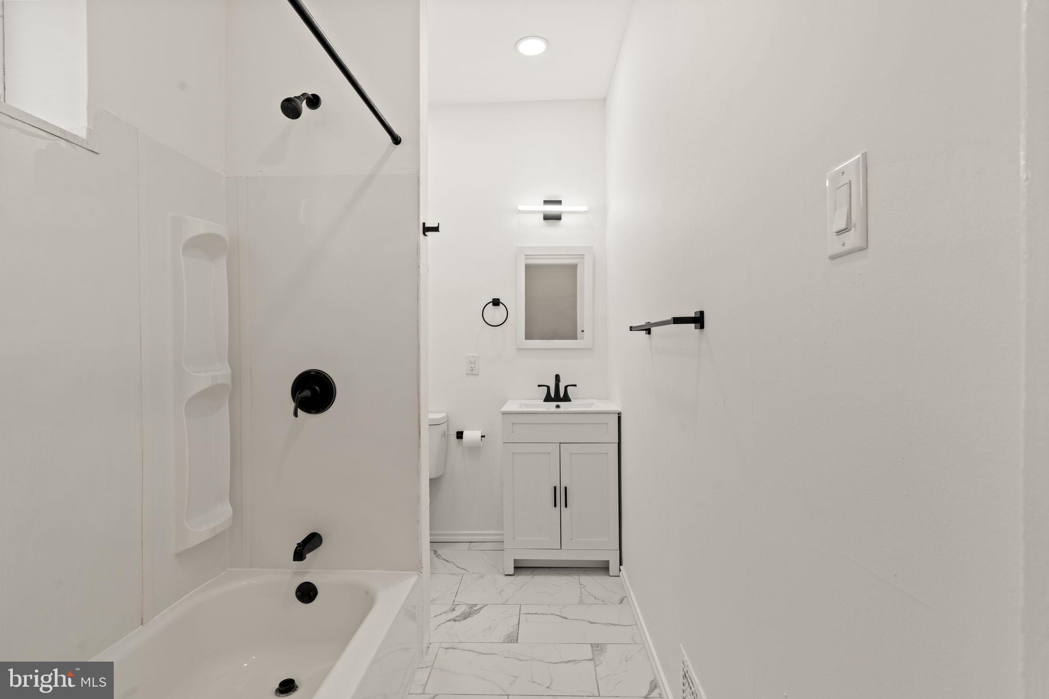 4466 North 3rd Street Philadelphia, PA 19140 - Photo 14 of 28 a bathroom with a bathtub and shower