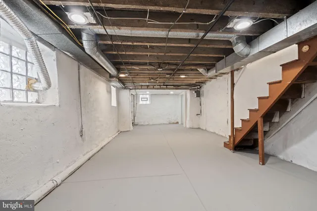 a view of an empty room with stairs