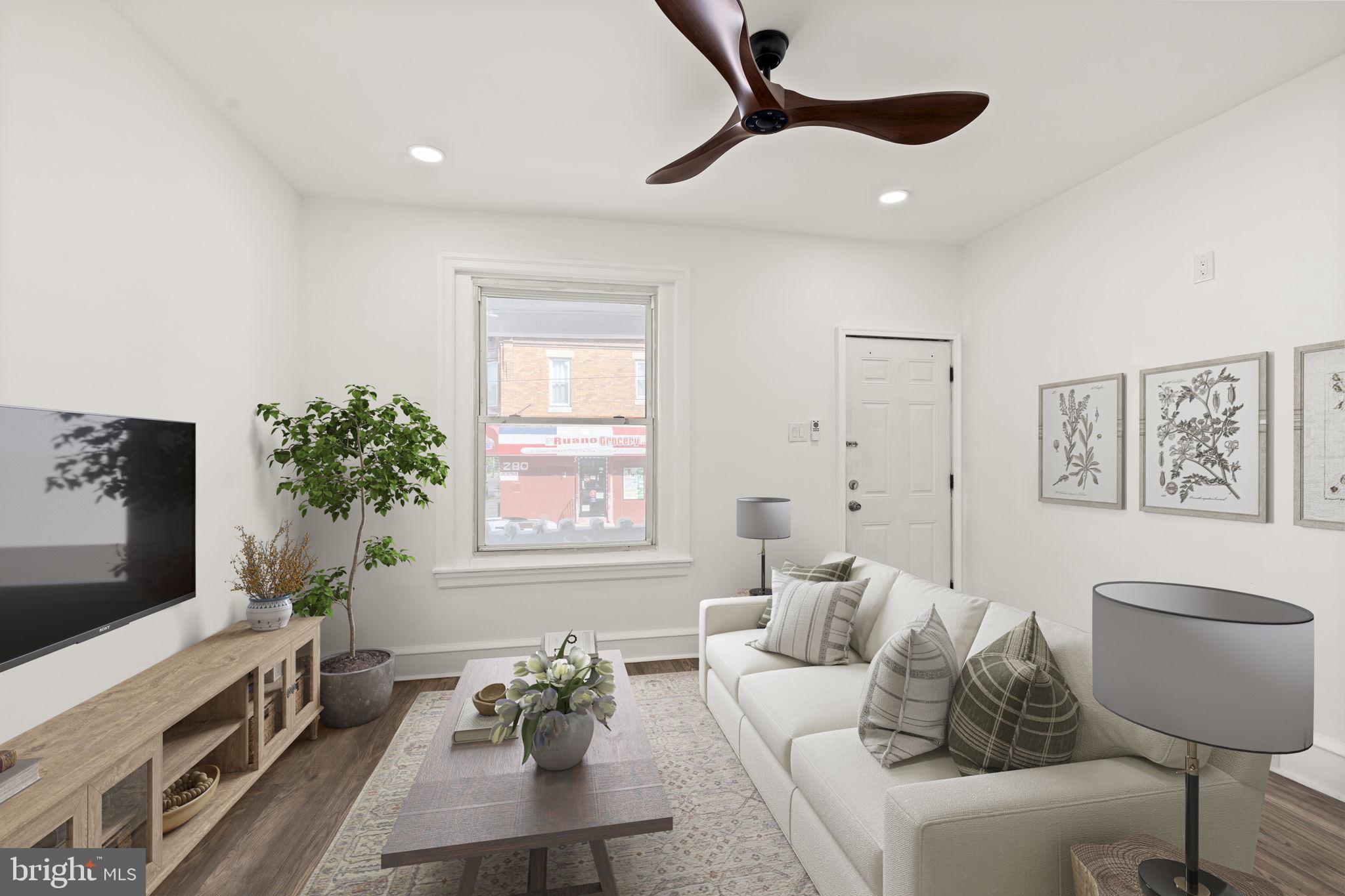 4466 North 3rd Street Philadelphia, PA 19140 - Photo 5 of 28 a living room with furniture and a flat screen tv
