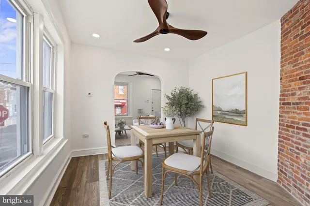 a dining room with furniture and window