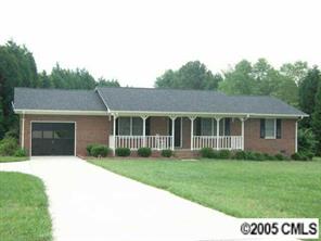 916 Stevens Road Monroe, NC 28110 - Photo 1 of 8 a front view of a house with a garden