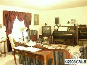 916 Stevens Road Monroe, NC 28110 - Photo 3 of 8 a bed sitting in a bedroom next to a window