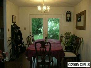 916 Stevens Road Monroe, NC 28110 - Photo 5 of 8 a view of a dining room with furniture and chandelier