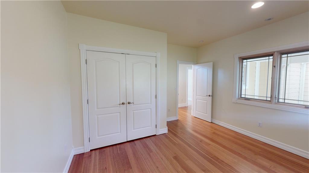 124 Welter Road Butler, PA 16002 - Photo 16 of 22 an empty room with wooden floor and windows