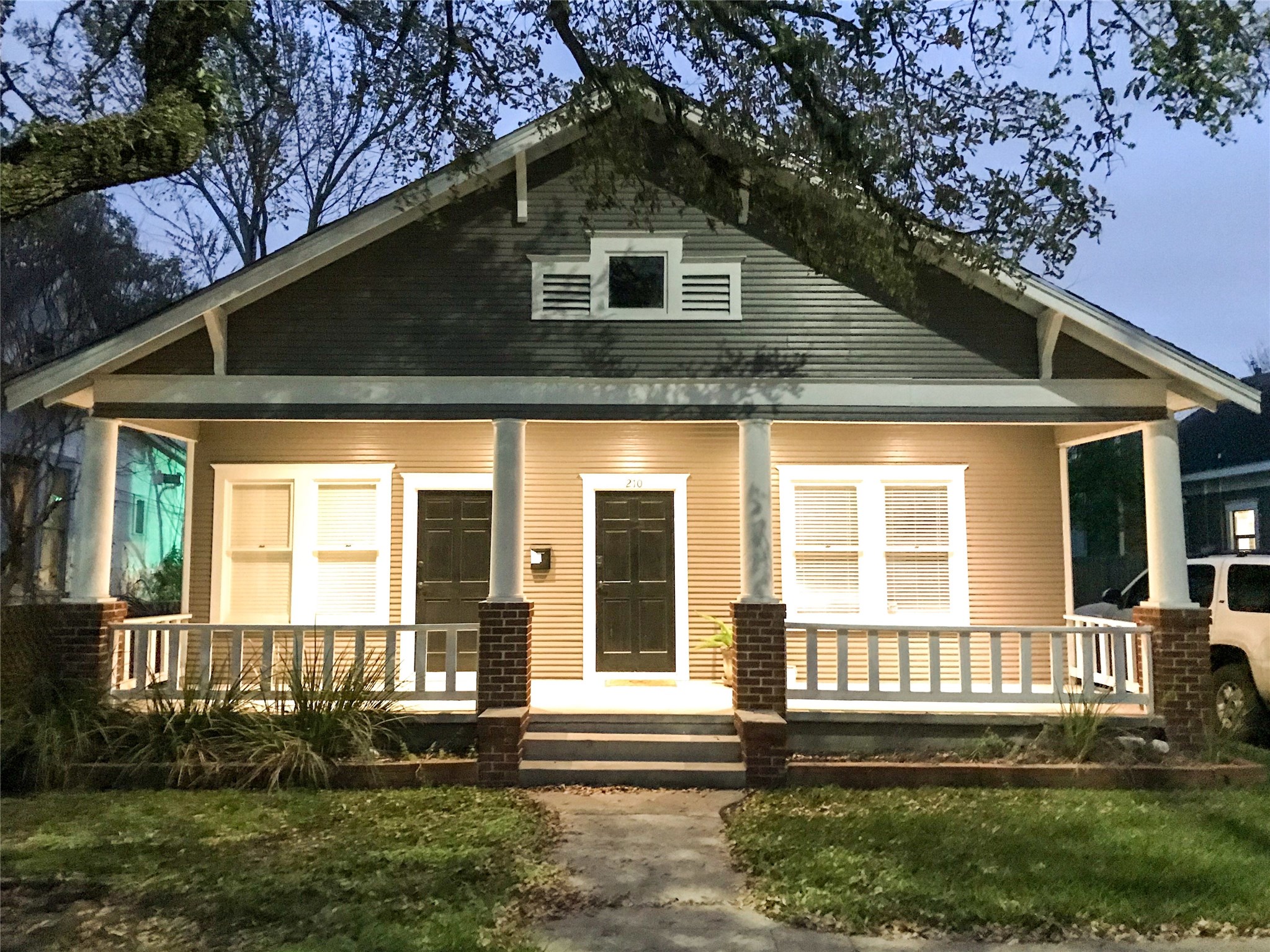 210 Tabor Street Houston, TX 77009 - Photo 1 of 20 a front view of a house with a yard